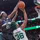 Jrue Holiday blocks Marcus Smart.